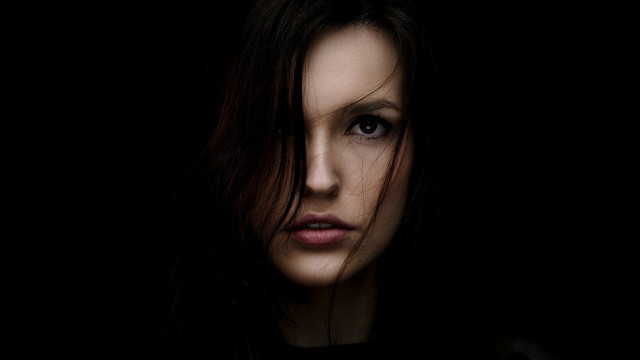 Woman serious look black shirt free wallpaper for desktop - medium preview image