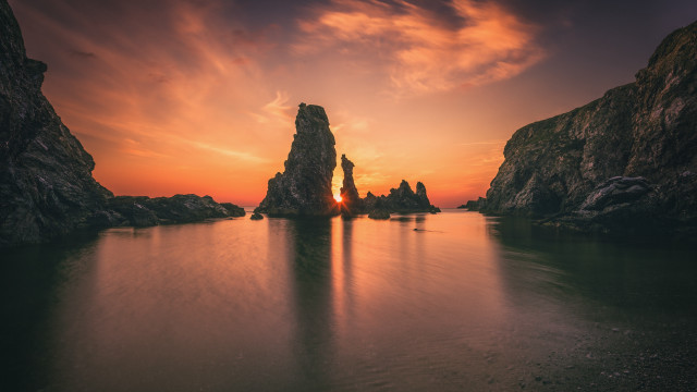 Sunset water rocks clouds boats free wallpaper for desktop - medium preview image