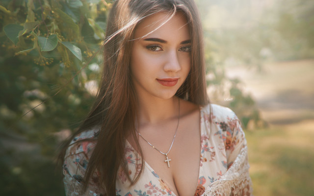 Woman longhair crossnecklace outdoor portrait free wallpaper for desktop - medium preview image