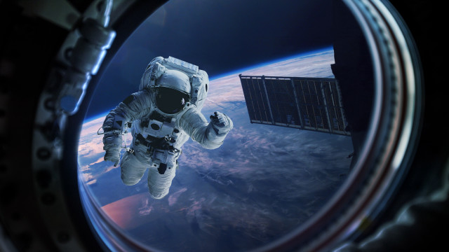 Astronaut floating space satellite earth free wallpaper for desktop - medium preview image