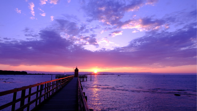 Pier lighthouse sunset clouds water free wallpaper for desktop - medium preview image