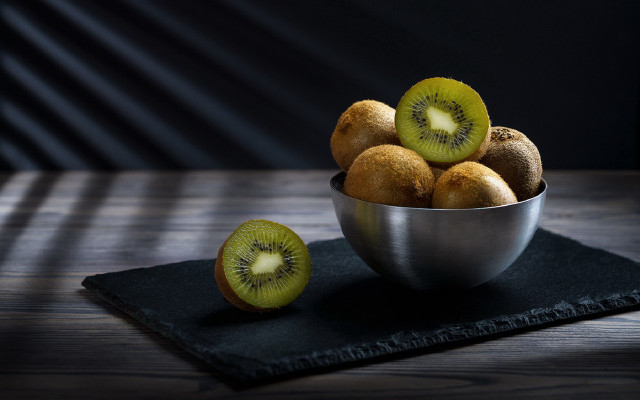 Kiwi bowl black cloth table free wallpaper for desktop - medium preview image