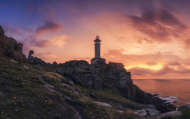 Lighthouse rocky cliff sunset mystical free wallpaper for desktop - medium preview image