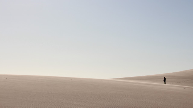 Desert lone person sand dunes free wallpaper for desktop - medium preview image