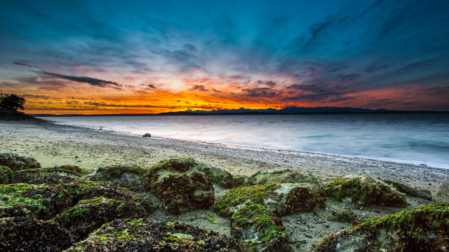 Beach sunset rocky shore mountain free wallpaper for desktop - medium preview image