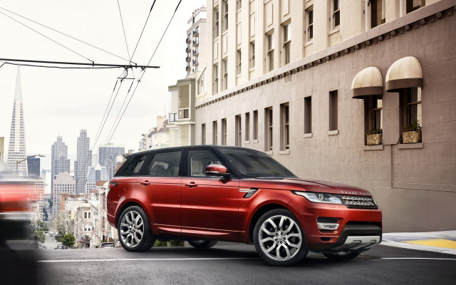 Red range rover city street free wallpaper for desktop - medium preview image