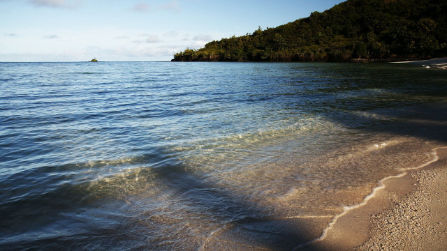 Beach island boat sky mountain free wallpaper for desktop - medium preview image
