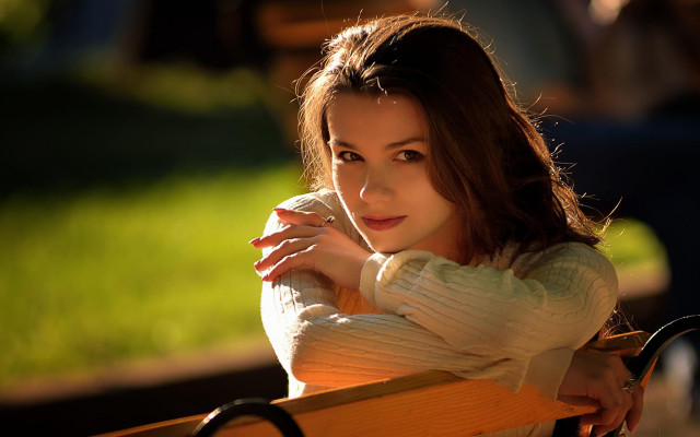 Serious woman bench brown eyes free wallpaper for desktop - medium preview image