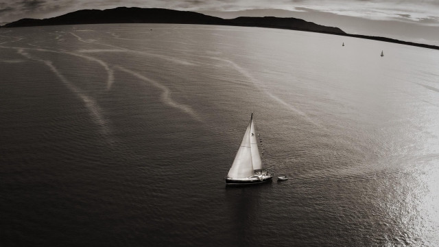 Sailboat mountains ocean clouds blackwhite free wallpaper for desktop - medium preview image