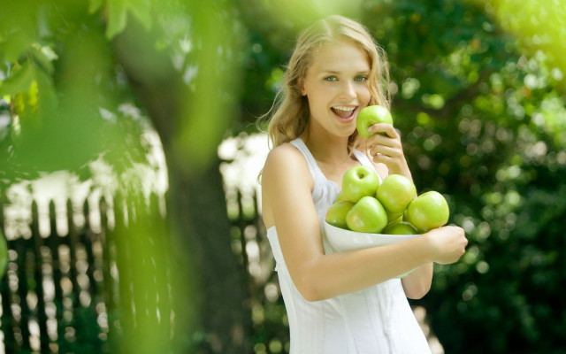 Woman green apples smiling outdoor free wallpaper for desktop - medium preview image