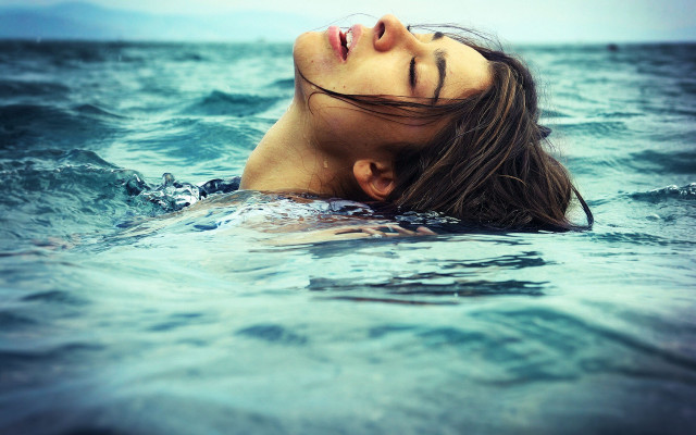 Woman ocean floating closed eyes free wallpaper for desktop - medium preview image