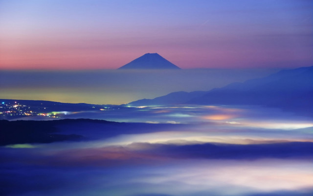 Mystical mountain city foggy night free wallpaper for desktop - medium preview image