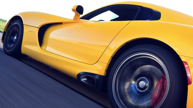 Yellow sports car blurry wheels free wallpaper for desktop - medium preview image