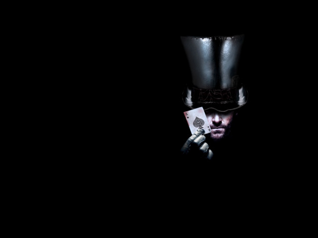 Man top hat holding card free wallpaper for desktop - medium preview image