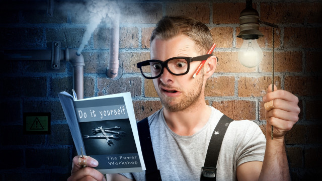 Bald man holding light bulb free wallpaper for desktop - medium preview image