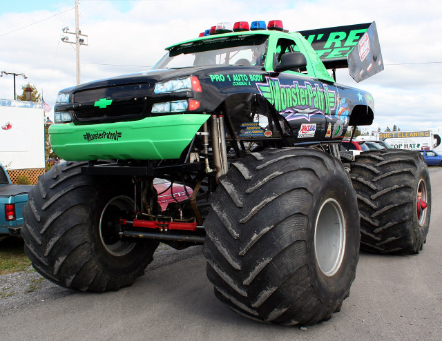 Monster truck large tire road free wallpaper for desktop - medium preview image