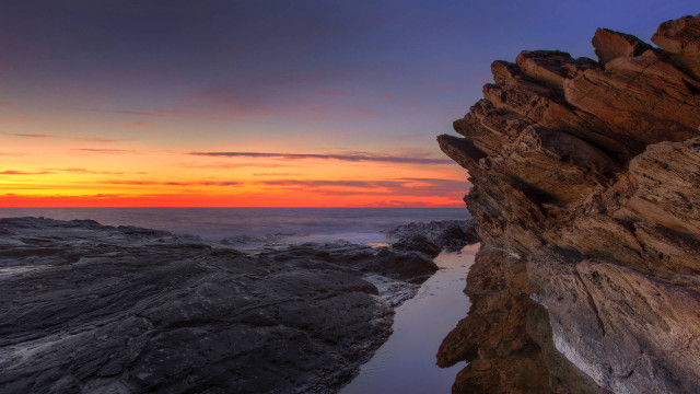 Rocky cliff sunset cloudy sky free wallpaper for desktop - medium preview image