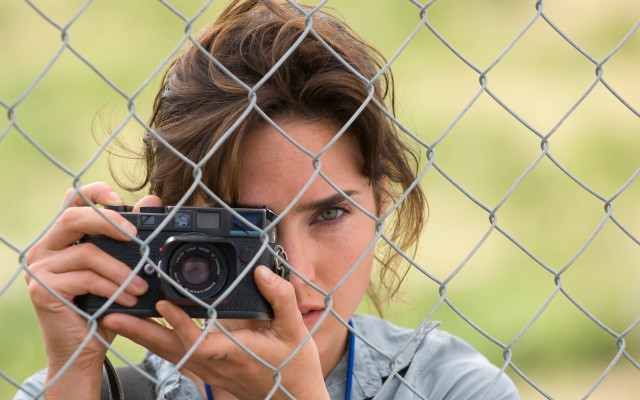 Woman camera fence look through free wallpaper for desktop - medium preview image