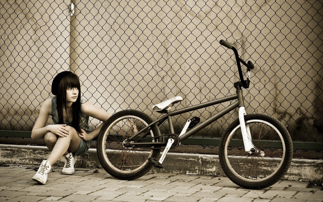 Woman bike fence graffiti art free wallpaper for desktop - medium preview image