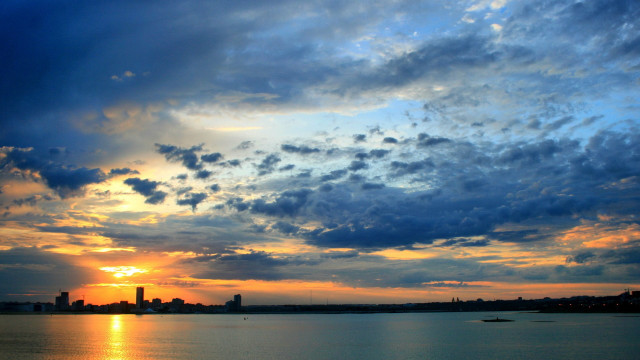 Sunset water city lights clouds free wallpaper for desktop - medium preview image