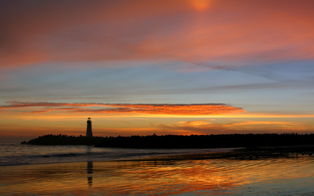 Lighthouse sunset ocean island portrait free wallpaper for desktop - medium preview image
