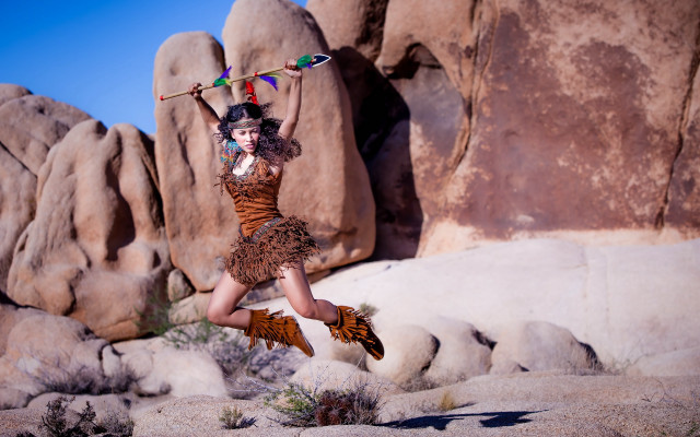 Woman jumping broom rock formation free wallpaper for desktop - medium preview image