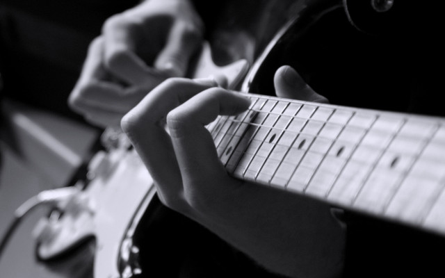 Person playing guitar fingers neck free wallpaper for desktop - medium preview image