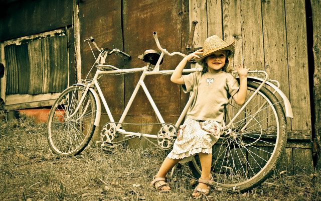 Young girl bicycle barn hat free wallpaper for desktop - medium preview image