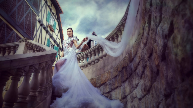 Woman white dress stone staircase free wallpaper for desktop - medium preview image