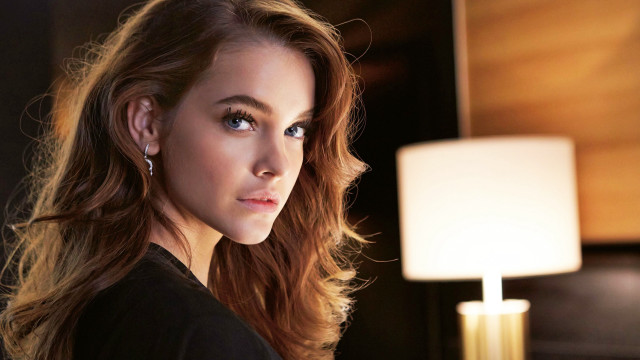 Serious woman long hair lamp free wallpaper for desktop - medium preview image