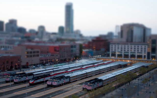 Train yard cityscape tiltshift blurry free wallpaper for desktop - medium preview image