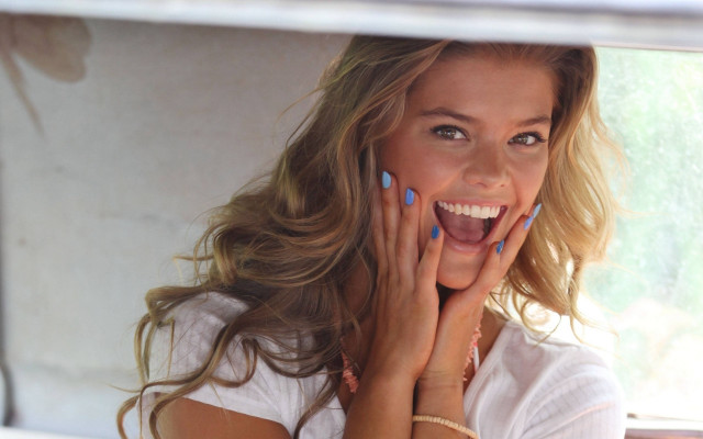 Cheerful woman blue nails smiling free wallpaper for desktop - medium preview image