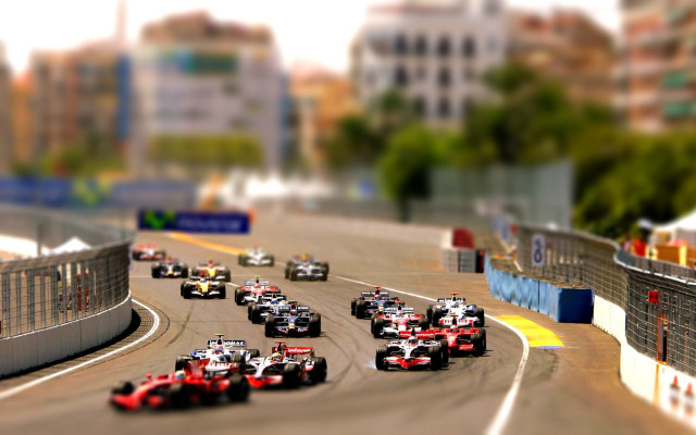 Racecars cityscape tiltshift blur bokeh free wallpaper for desktop - medium preview image