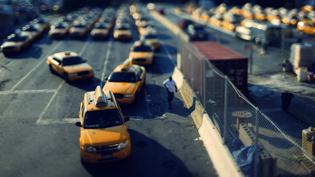 Yellow taxis parking lot tilt free wallpaper for desktop - medium preview image