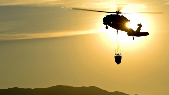 Helicopter sunset silhouette ocean rimlight free wallpaper for desktop - medium preview image