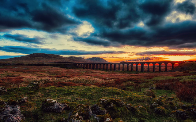 Train greenfield cloudy sunset cityscape free wallpaper for desktop - medium preview image