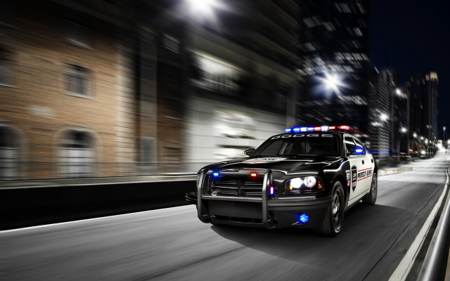 Police car city street night free wallpaper for desktop - medium preview image