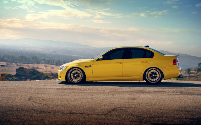 Yellow car mountain road sky free wallpaper for desktop - medium preview image
