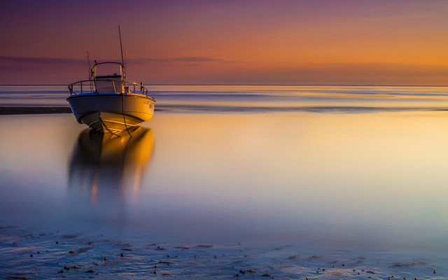 Boat shore beach sunset ocean free wallpaper for desktop - medium preview image