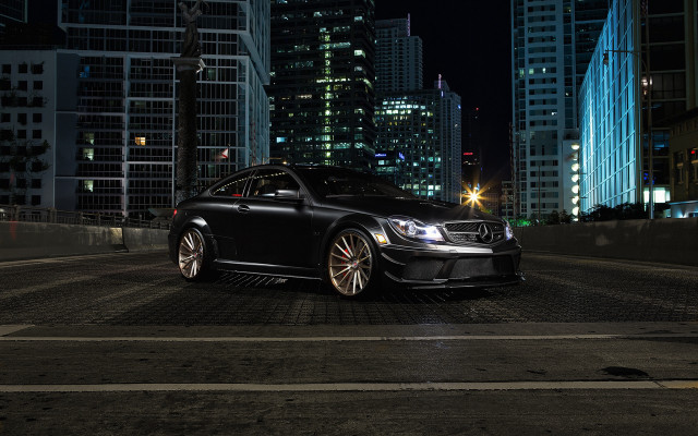 Black car city skyline night free wallpaper for desktop - medium preview image