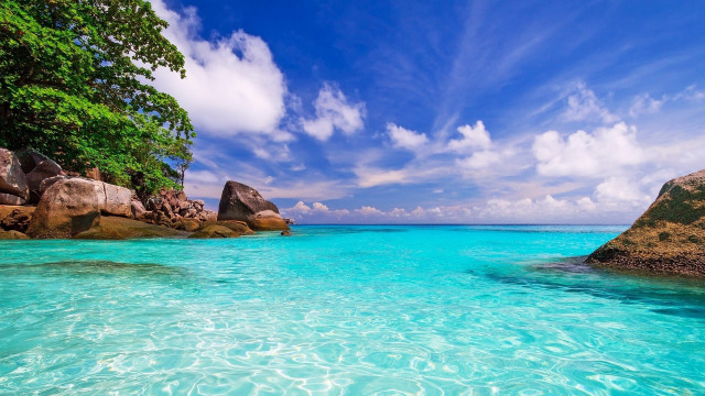 Blue ocean rocks clouds beach free wallpaper for desktop - medium preview image