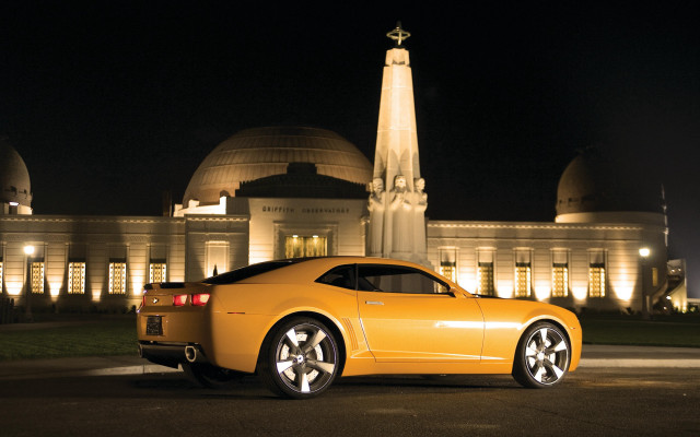 Yellow sports car night clocktower free wallpaper for desktop - medium preview image
