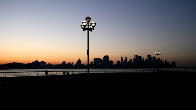 Streetlight water sunset city silhouette free wallpaper for desktop - medium preview image
