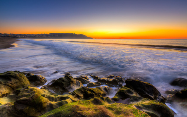 Sunset beach rocks water city free wallpaper for desktop - medium preview image