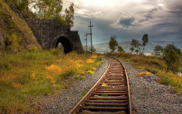 Train tunnel cloudy sky cityscape free wallpaper for desktop - medium preview image