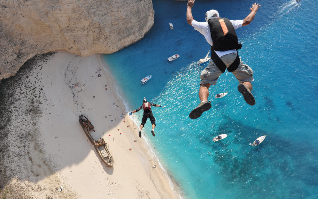 Cliff jump ocean beach boats free wallpaper for desktop - medium preview image