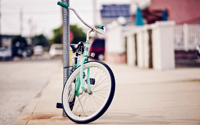 Bicycle pole city street shallow free wallpaper for desktop - medium preview image