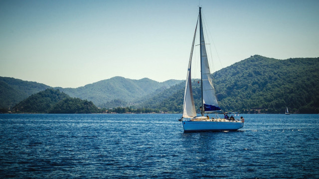 Sailboat lake mountains blue sky free wallpaper for desktop - medium preview image