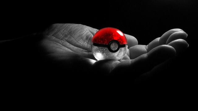 Hand holding pokeball shock art free wallpaper for desktop - medium preview image