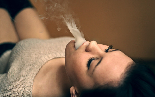 Woman laying smoke blurry photorealistic free wallpaper for desktop - medium preview image